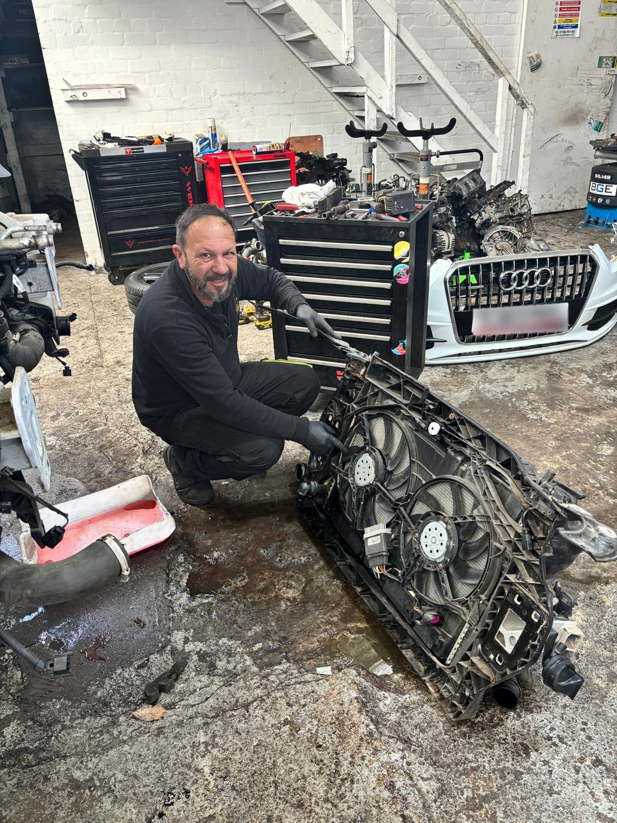 Bircan Ezin completing Audi front radiator replacement